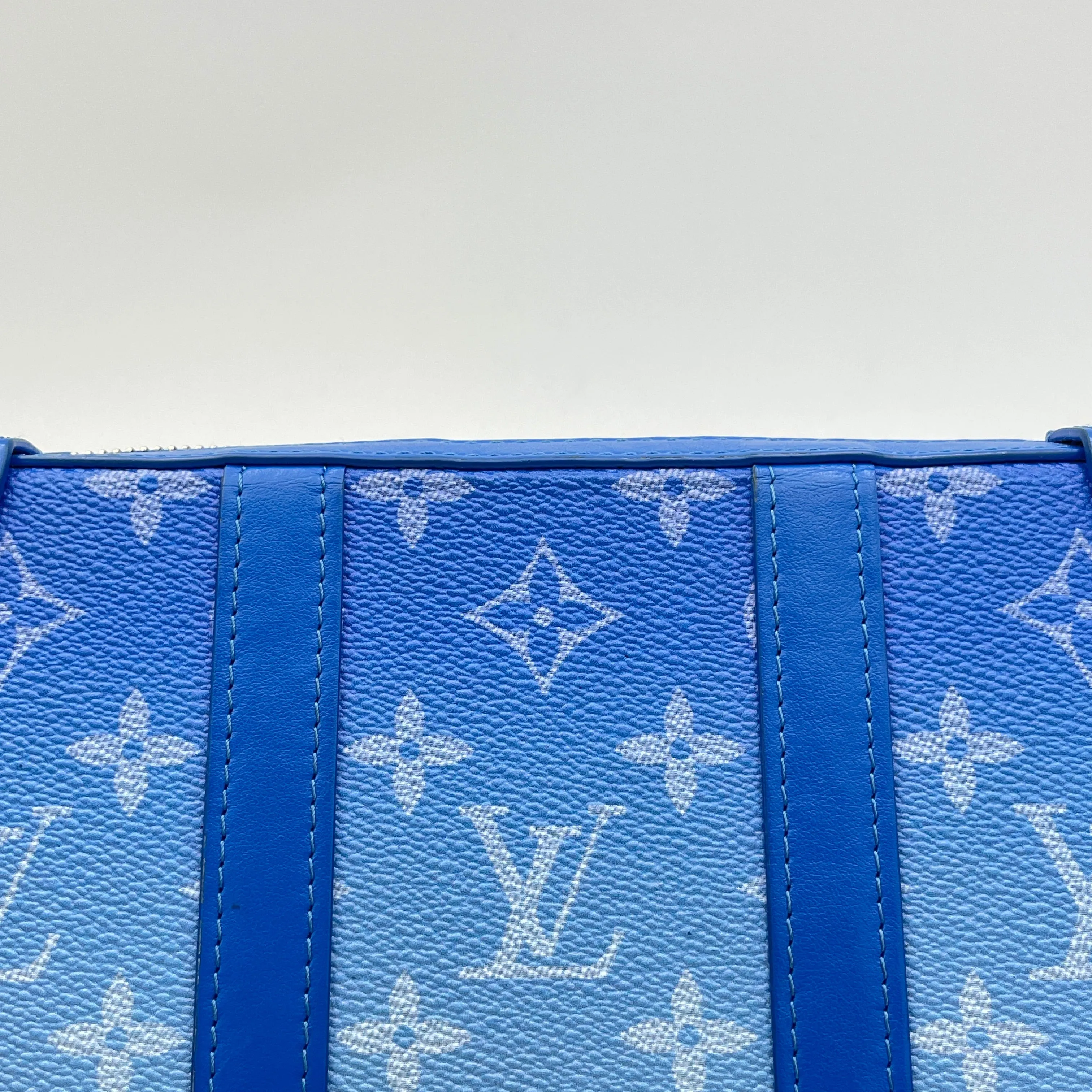 Clouds Soft Trunk Wallet Blue Crossbody Bag in Monogram Coated Canvas, Silver hardware